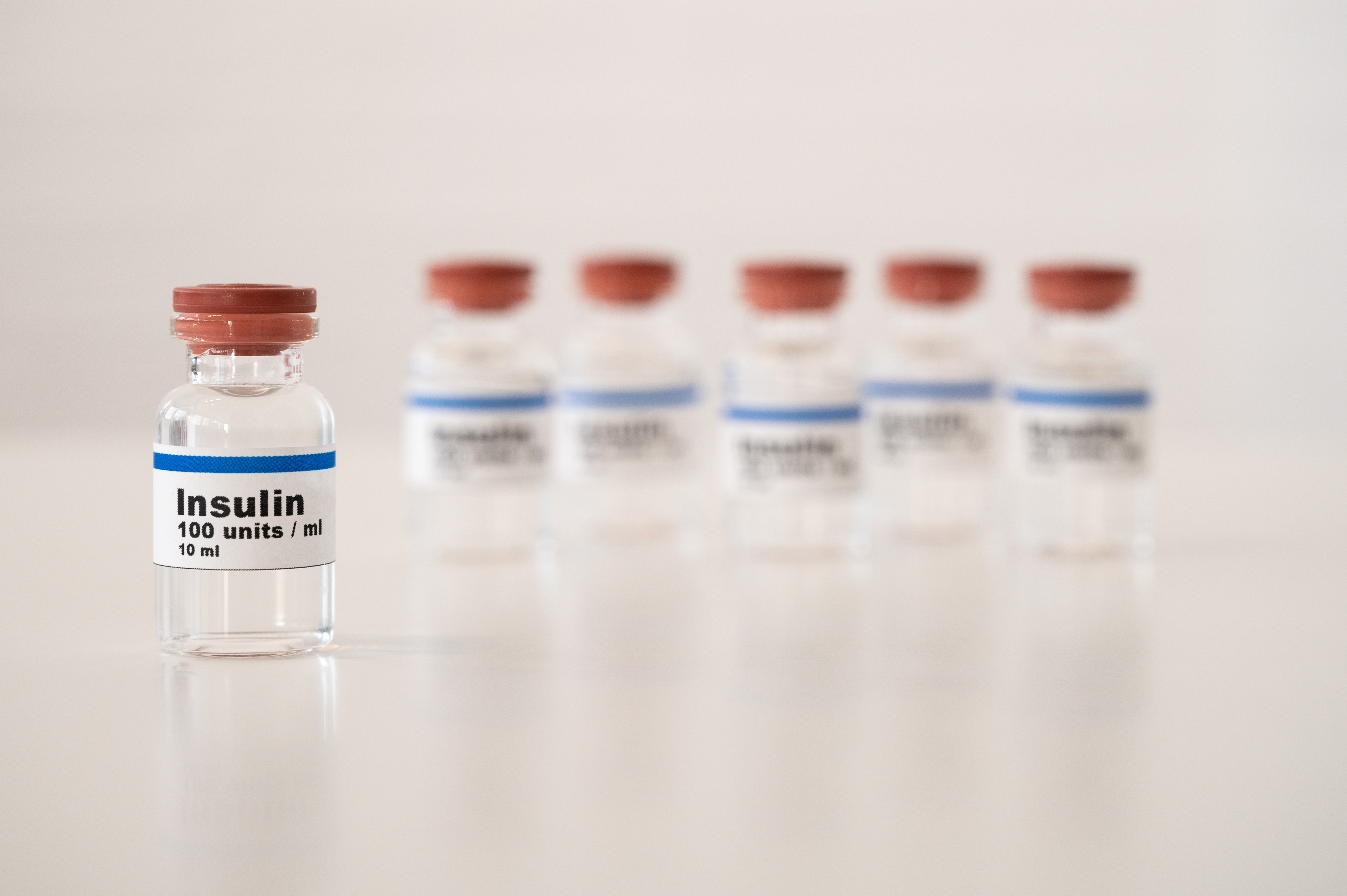 Insulin,Vials,Against,A,White,Background:,Properly,Cooling,And,Storing